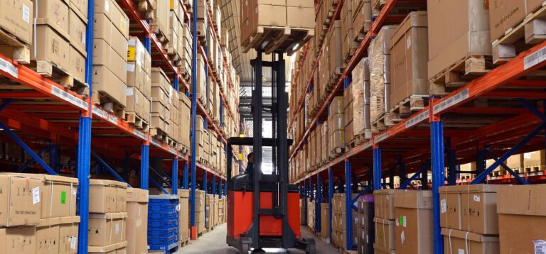 Fork lifter in a warehouse managed by Global Surveys