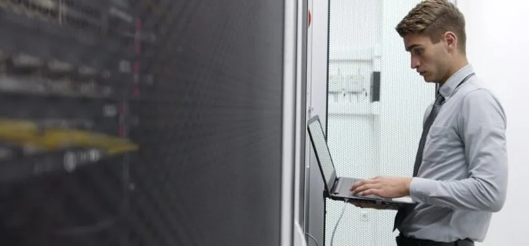 IT expert checking supercomputer server
